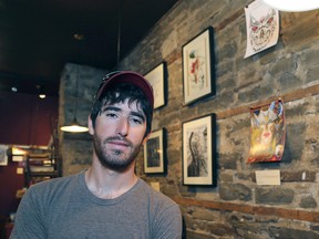 Kingston city council passed a motion that would see wording added to the official plan for the inclusion of arts studios and galleries in new downtown developments, like the one co-organized by Eric John, in August, which was displayed at the Sleepless Goat Cafe. (Ian MacAlpine/Whig-Standard file photo)