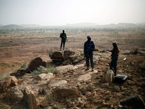 In this Thursday, Jan. 24, 2013 file photo, Malian troops man an observation post outside Sevare, some 620 kms (385 miles) north of Mali's capital Bamako. (AP Photo/Jerome Delay, File)