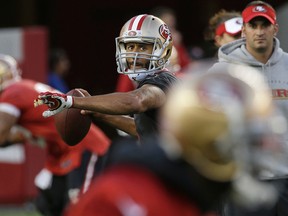 San Francisco 49ers quarterback Colin Kaepernick throws a pass during the team's NFL football training camp in Santa Clara, Calif., on Aug. 1, 2015. (AP Photo/Jeff Chiu)