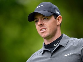 This May 22, 2015 file photo shows Northern Irish golfer Rory McIlroy reacting to a shot on the second day of the PGA Championship at Wentworth Golf Club in Surrey, England. (AFP PHOTO/GLYN KIRK)