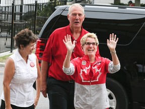 Bill Blair, federal Liberal Candidate for Scarborough Southwest greets Ontario Premier Kathleen Wynne, with his wife Susan, at the opening of his campaign office along Kingston Rd., on Aug. 8, 2015. (Veronica Henri/Toronto Sun)