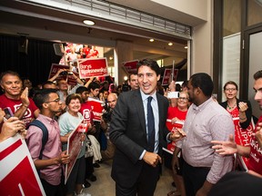 Liberal leader Justin Trudeau shakes hands with supporters during a campaign rally in Toronto on Friday, August 7, 2015.  THE CANADIAN PRESS/Aaron Vincent Elkaim