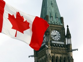 The Canadian flag flies on Parliament Hill in Ottawa August 2, 2015. Canadian Prime Minister Stephen Harper was set to call a parliamentary election for Oct 19 on Sunday, kicking off a marathon 11-week campaign likely to focus on a stubbornly sluggish economy and his decade in power. REUTERS/Blair Gable