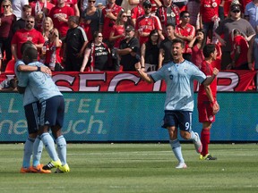 Sporting Kansas City players celebrate after scoring against Toronto FC on Saturday. (REUTERS)