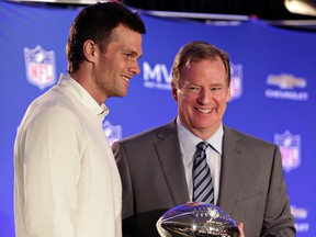 New England Patriots quarterback Tom Brady, left, poses with NFL Commissioner Rodger Goodell during a news conference where Brady was presented the Super Bowl MVP in Phoenix, Ariz. (John Samora/AP File)