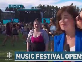 CBC reporter Megan Batchelor is kissed by a man during a live report at  a Squamish music festival.