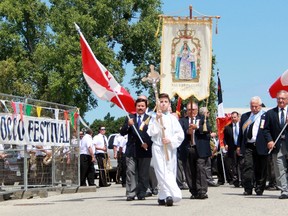 Alessio Tersigni, 13, of Sarnia leads a procession around Clearwater Arena Sunday as part of the San Rocco Festival. The event was held locally for the 43rd time. Terry Bridge/Sarnia Observer/Postmedia Network