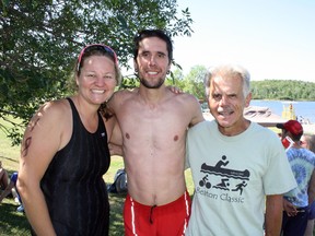 Tamara Flannigan (left), Pascal Renard and John Larmer gather for a celebratory photo after they, along with James Larmer, won the team relay event at the Beaton Classic at Moonlight Beach on Sunday. Ben Leeson/The Sudbury Star/Postmedia Network