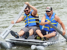 Caleb Dionne, left, and Matthew Armitage take part in the Wambo cardboard races held on the Sydenham River on Saturday, August 8, 2015 in Wallaceburg, Ont. (DAVID GOUGH/COURIER PRESS/Postmedia Network)