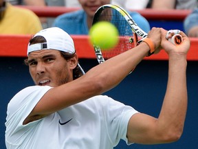Rafael Nadal of Spain hits the ball during practice session at Uniprix Stadium. Eric Bolte-USA TODAY Sports