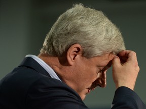 Conservative Leader Stephen Harper pauses as he deliver a speech at a rally in Quebec City on Sunday, August 9, 2015. THE CANADIAN PRESS/Sean Kilpatrick