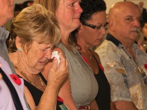 Mary Katherine Keown/The Sudbury Star
Dorothy Unrau, flanked by her children, cries during an emotional ceremony on Sunday to mark National Peacekeepers’ Day. She lost her son, John, in July.