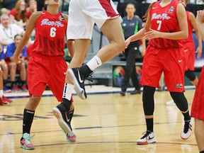 Miranda Ayim charges for Canada against Puerto Rico during the FIBA Americas tournament opener at the Saville Centre last night.