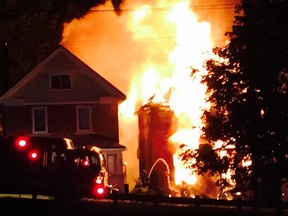 A home burns on 4th Ave. E early Monday morning. (Dorothy McGregor photo)