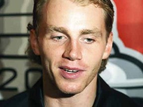 In this July 17, 2015, file photo, Chicago Blackhawks' Patrick Kane speaks with reporters during the NHL hockey team's annual convention in Chicago. The NHL says it is "following developments" of a police investigation involving Chicago Blackhawks star Patrick Kane, Thursday, Aug. 6, 2015. (Daniel White/Daily Herald via AP, File)