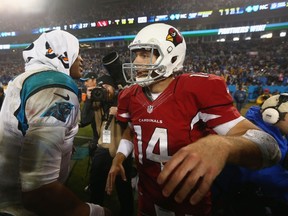 Cam Newton #1 of the Carolina Panthers and Ryan Lindley #14 of the Arizona Cardinals exchange words after their NFC Wild Card Playoff game at Bank of America Stadium on January 3, 2015 in Charlotte, North Carolina.   Streeter Lecka/Getty Images/AFP