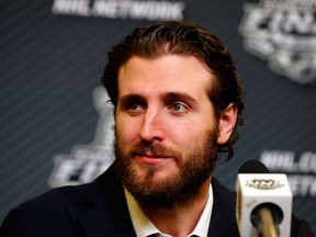 Mike Richards #10 of the Los Angeles Kings speaks to the media at a press conference following Game Three of the 2014 NHL Stanley Cup Final against the New York Rangers at Madison Square Garden on June 9, 2014 in New York, New York.  Jim McIsaac/Getty Images/AFP