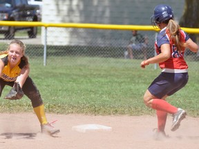 Lydia Duncan (left) of the Mitchell Bantam girls waits for the ball during this St. Marys stolen base during action from their Huron-Perth final game Sunday in Stratford. St. Marys snapped a 1-1 tie with a six-run fourth to defeat the Hornets, 7-2. ANDY BADER/MITCHELL ADVOCATE