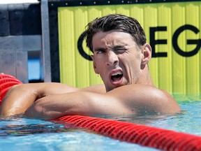 Michael Phelps checks the board for his time after he competed in the preliminary round of the men's 200-metre breaststroke at the the U.S. swimming nationals on Aug. 10, 2015, in San Antonio. (AP Photo/Eric Gay)