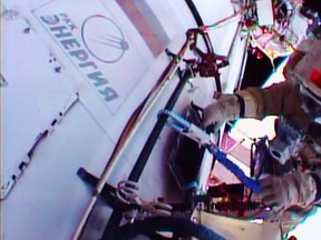This August 10, 2015 image from NASA TV shows Russian Flight Engineer Mikhail Kornienko working outside the International Space Station. ISS Expedition 44 Commander Gennady Padalka and Kornienko will install devices called gap spanners on the hull of the station that will facilitate the movement of crew members on future spacewalks. They also will clean residue off of the windows of the Zvezda Service Module, install fasteners on communications antennas, replace an aging antenna used for the rendezvous and docking of visiting vehicles at Russian docking ports, and photograph a variety of locations and hardware on Zvezda and nearby modules. An experiment designed to measure the space environment first deployed in 2013 will be retrieved and brought inside for its return to Earth. (AFP PHOTO / HANDOUT / NASA TV)