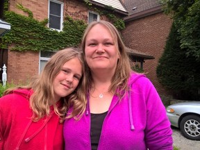 Elissa and Kristina Korvenpaa, right, ran from their burning 4th Ave. E. home this morning after a firefighter kicked in their door and told them to get out because their house was on fire. (Scott Dunn/The Sun Times, Owen Sound)