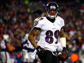 Steve Smith #89 of the Baltimore Ravens celebrates after scoring a touchdown in the first quarter against the New England Patriots during the 2014 AFC Divisional Playoffs game at Gillette Stadium on January 10, 2015 in Foxboro, Massachusetts.   Jared Wickerham/Getty Images/AFP