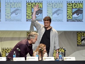 (L-R) Writer PJ Haarsma, actors Nathan Fillion and Sky Haarsma speak onstage during "Con Man" The Fan Revolt 13 Years In The Making panel during Comic-Con International 2015 at the San Diego Convention Center on July 9, 2015 in San Diego, California.  Kevin Winter/Getty Images/AFP