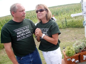 Brian Visneskie and Kathy Morlang stand at the roadside memorial put together for their son, Michael Morlang. Aug. 11 marks two years the 30-year-old Morland died after injuries received from a hit-and-run incident on Frank Kenny Rd.
MATT DAY/OTTAWA SUN
