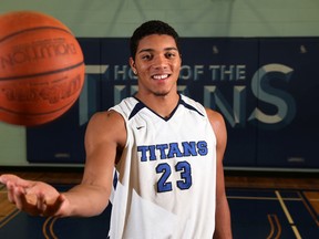 Eddie Ekiyor, a 6-feet 9-inch basketball player shown here while playing with the Mother Teresa Titans in 2014 has been charged by Ottawa police in a hit-and-run case where an off-duty police officer was struck and injured while cycling.
Mike Carrocetto/Postmedia file photo