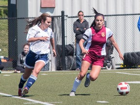 Katie Balfour, pictured right, both plays and coachs for the Kingston United soccer club. She’ll be heading to Carleton this fall on a $5000 per year soccer scholarship. (Tim Gordanier/For The Kingston Whig-Standard)