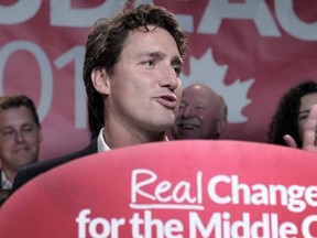 Canada's federal Liberal Party leader Justin Trudeau delivers remarks during an electoral meeting in Montreal, August 10, 2015. Canadians go to the polls in a national election on October 19, 2015.    AFP PHOTO / MARC BRAIBANT