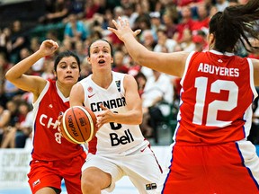 Canada's Shona Thorburn is harassed by Chile's Francisca Rojas, left, and Catalina Abuyeres, right, during Canada's 2015 FIBA Americas Women's Championship basketball game against Chile at the Saville Community Sports Centre in Edmonton, Alta. on Monday, Aug. 10, 2015. Codie McLachlan/Edmonton Sun/Postmedia Network