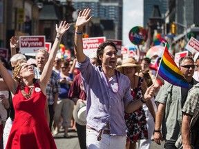 Liberal Party of Canada leader Justin Trudeau (R) and Canada's first openly gay Ontario Premier Kathleen Wynne march during the gay pride parade in Toronto, June 30, 2013.    REUTERS/Mark Blinch