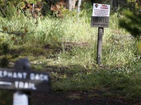 A sign is seen at the Elephant Back Loop Trailhead which is temporarily closed to travel in Yellowstone National Park, Wyoming August 9, 2015.  At least one grizzly bear attacked a hiker who was found dead and partially eaten in Yellowstone National Park in Wyoming, judging by wounds on his arms, park officials said on Saturday. A park ranger found the hiker's body on Friday in a popular back-country area near the Elephant Back Loop Trail near Yellowstone Lake in the middle of the park, park officials said. REUTERS/Jim Urquhart