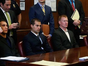 (L to R seated) Andrew Rossig, Marco Markovich, James Brady and Kyle Hartwell appear in Manhattan Criminal Court in New York May 6, 2014. Rossig and Brady are two of the three BASE jumpers who parachuted from the top of the 104-story One World Trade Center in September 2013 have been sentenced to a $2,000 fine and community service August 10, 2015 in a Manhattan state court.  Markovich, will be sentenced August 17, 2015.  REUTERS/Brendan McDermid/Files