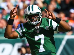 Geno Smith of the New York Jets celebrates after throwing a touchdown pass against the Denver Broncos at MetLife Stadium on October 12, 2014 in East Rutherford, New Jersey. (Elsa/Getty Images/AFP)