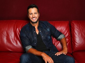 In this July 14, 2015 photo, Luke Bryan poses for a portrait at Audio Productions in Nashville, Tenn., to promote his latest album, "Kill the Lights." (Photo by Donn Jones/Invision/AP)