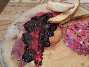 12 Acres’ beef/tomato tartare with Saskatoon jelly and wedge potatoes.