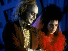 Michael Keaton and Winona Ryder in a scene from Beetlejuice. (Handout)