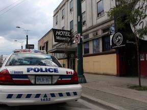 Toronto Police at the scene at the Waverly Hotel after a woman was found dead Tuesday, Aug. 11, 2015. (Nick Westoll/Toronto Sun)
