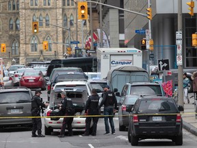 Police patrol near Parliament Hill in Ottawa on Wednesday Oct. 22, 2014 after the shooting at the war Memorial. Tony Caldwell/Ottawa Sun/QMI Agency