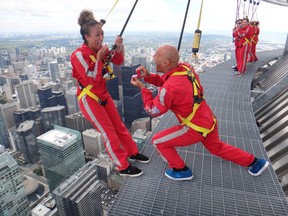 Warren Hudson, from Leeds, England, proposes to Leanne Taylor on the CN Tower Edge Walk on Tuesday Aug. 11, 2015. (Handout)