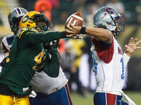 Eskimos defensive end Odell Willis slaps the ball out of Montreal quarterback Jonathan Crompton's hands last season at Commonwealth (Ian Kucerak, Edmonton Sun).
