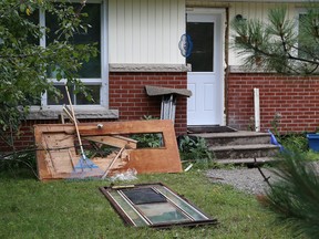 A front door was damaged by a sow bear and cub at a Muriel Crescent home in Sudbury, Ont. on Monday August 10, 2015. The animals entered the home and were destroyed by Greater Sudbury Police when the sow and cub exited the home. John Lappa/Sudbury Star/Postmedia Network