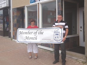 Laura LaBelle of Cochrane Wealth Management Inc. is July's Board of Trade member of the month. She is seen here with Marc Johnson.