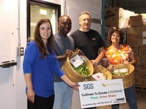 Isabelle Denault of the Town of Cochrane, Zak Abdourahamane and Ken Williams of SGS and Hélène Girard of the Cochrane Food Bank display some of the fresh vegetables grown by SGS.