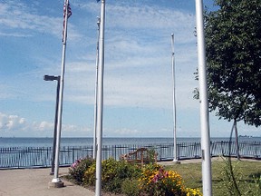 Mitchell's Bay residents are wondering why two of the five flag poles at Mitchell's Bay Wharf Park are not flying flags this summer. Chatham-Kent officials have said the flag poles are broken, but residents said the poles are fine. (DAVID GOUGH, Postmedia Network)