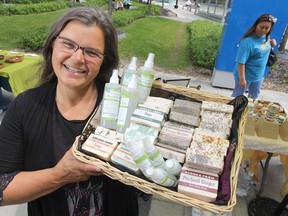 Louise May, of Aurora Farms, poses with the all-natural mosquito spray Manitoba Mist. (Chris Procaylo/Winnipeg Sun files)
