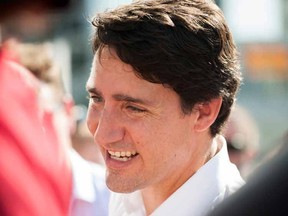 Liberal Leader Justin Trudeau greets the public during a campaign visit to the Regina Farmers' Market in Regina on Wednesday, August 12, 2015. THE CANADIAN PRESS/Michael Bell