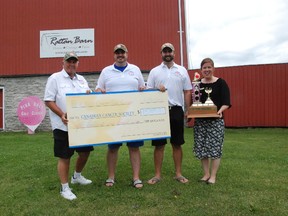 JESSICA LAWS/ FOR THE INTELLIGENCER
The Pink Ball Charity Golf Classic presented a donation cheque at the Rattan Barn in Corbyville for the Canadian Cancer Society's  Hastings-Prince Edward County & Brighton Community Office. Wayne Warner, Brad Warner, Jamie Chisholm and Tracey Reid were all on hand for the donation.